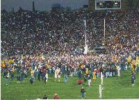 Notre Dame fans running onto the field.